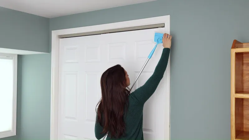 Wiping the corner of a door casing